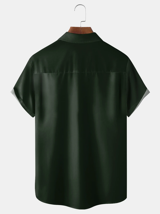 Maxcorners St. Patrick's Day Four Leaf Clover Black Dark Green Hawaiian Golf Shirt, St Paddy's Day Tropical Vibe Men's Golf Shirt